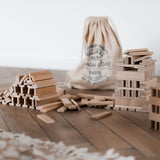 architectural wooden building blocks with cotton sack by wooden story