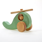 Wooden toy helicopter in sweetie Jane colour on a white background handmade by friendly toys