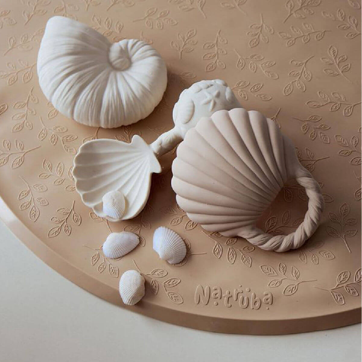 Close-up of Natruba Ocean Shell bath toy set on bath mat – non-toxic baby toys for teething and bathtime play