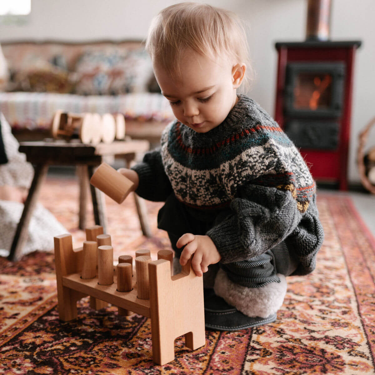 pound a peg Montessori wooden toy by wooden story
