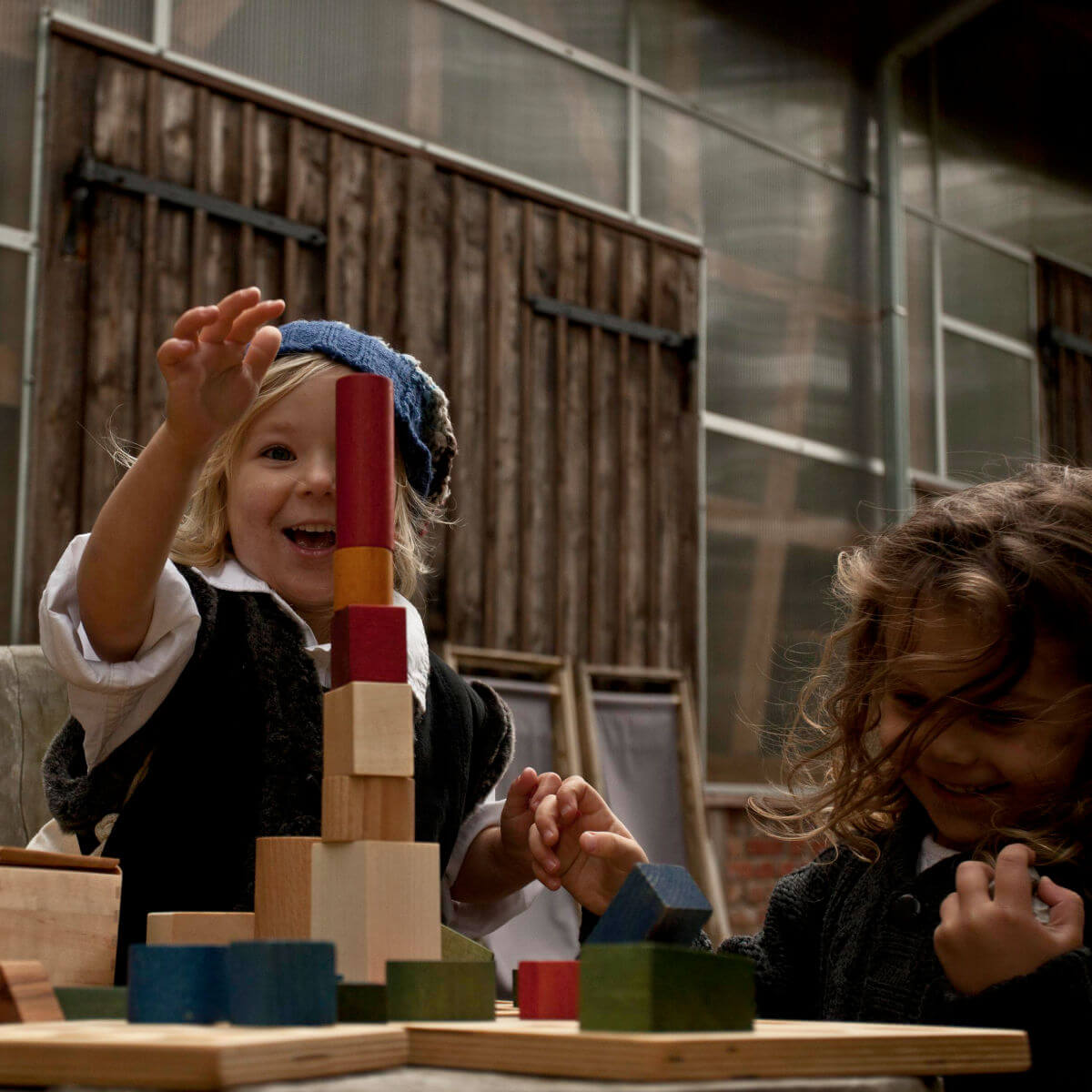 wooden building blocks in sack 100 pieces in rainbow colours by wooden story