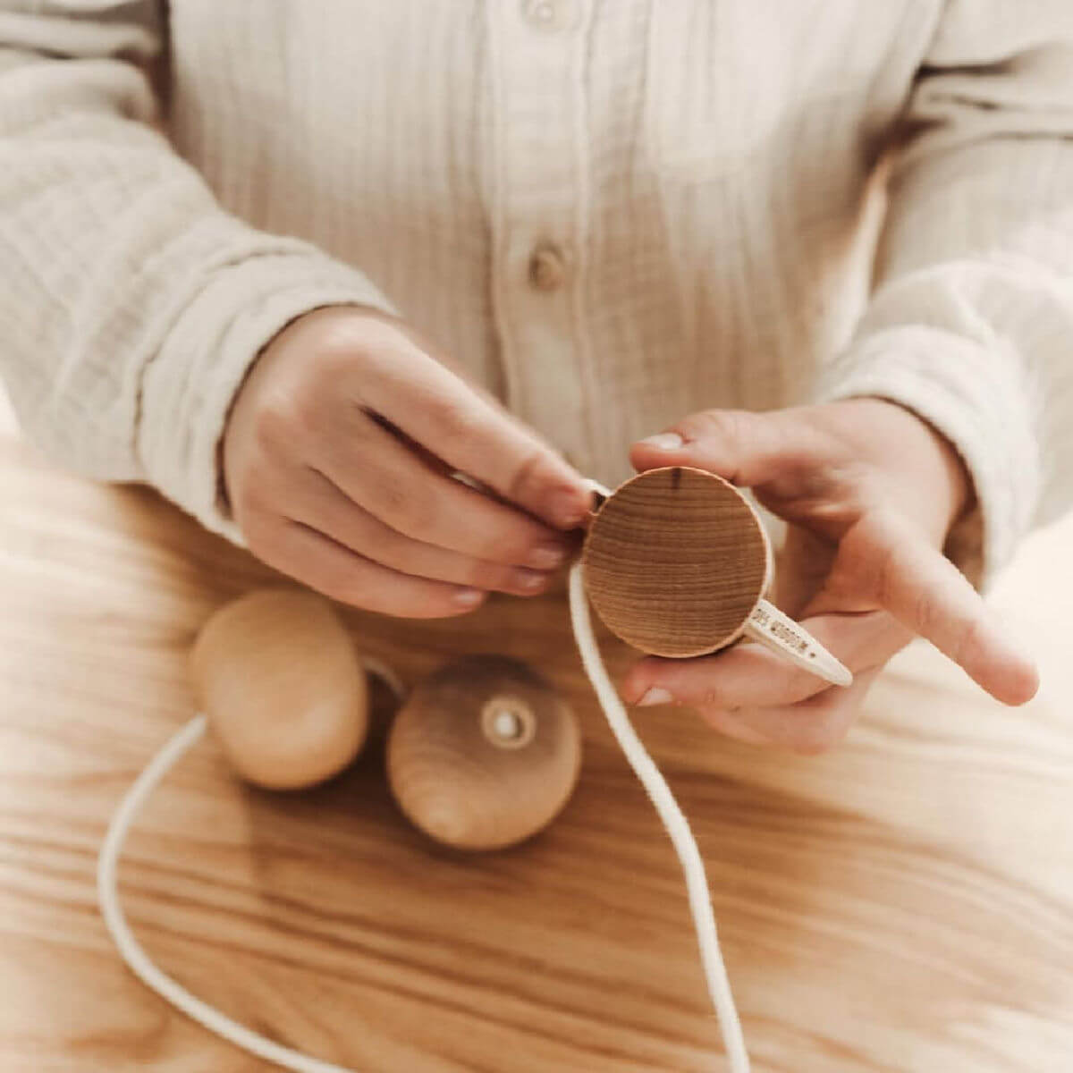 wooden needle threading toy by wooden story