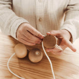 wooden needle threading toy by wooden story