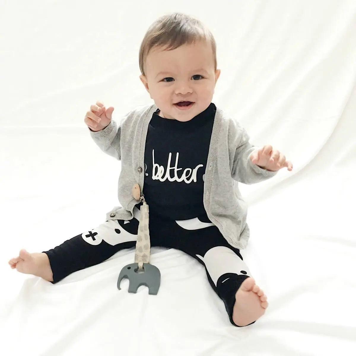 Organic dummy | pacifier | soother Clip in soft grey pom poms design at blue brontide uk