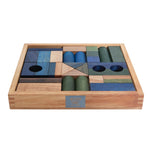 wooden building blocks in tray in cool colours by wooden story