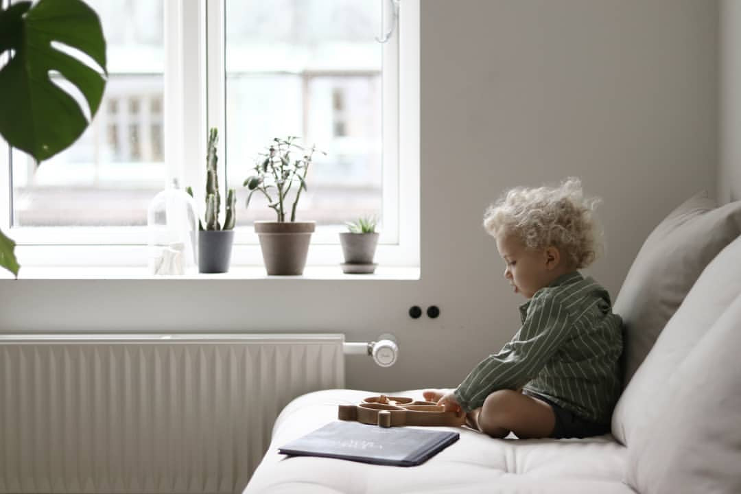 living sustainably with kids child with eco wooden plate