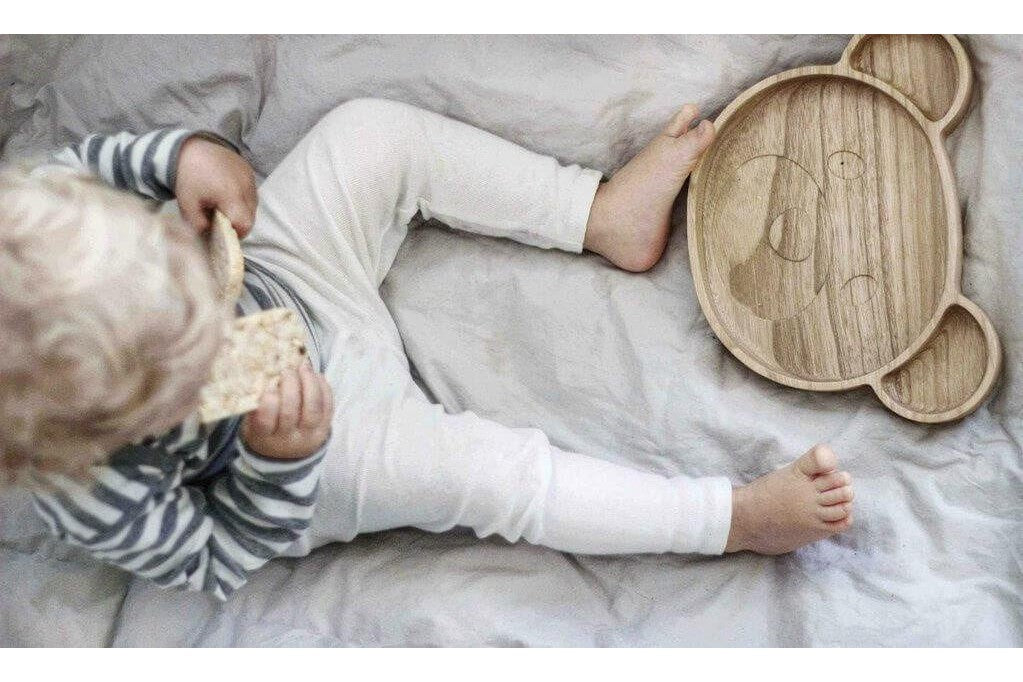 Healthy kids toddler bed-time snacks on wooden bear plate
