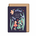 Woodland new baby greeting card with a scalloped dark navy border and a kraft paper envelope illustrated by Sister Paper Co. The card features whimsical floral artwork with bluebells, a bird, a small mouse in a red dress, flowers, and the text 'HELLO SWEET BABY'.