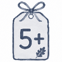 A watercolor-style gift tag illustration with a blue ribbon bow at the top, the number 5+ in large dark blue text, and a small leaf motif on a white tag against a light gray background.