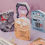 Dumpling New Baby card by Sister Paper Co. featuring three illustrated dumplings in a bamboo steamer with text congrats on your little dumpling