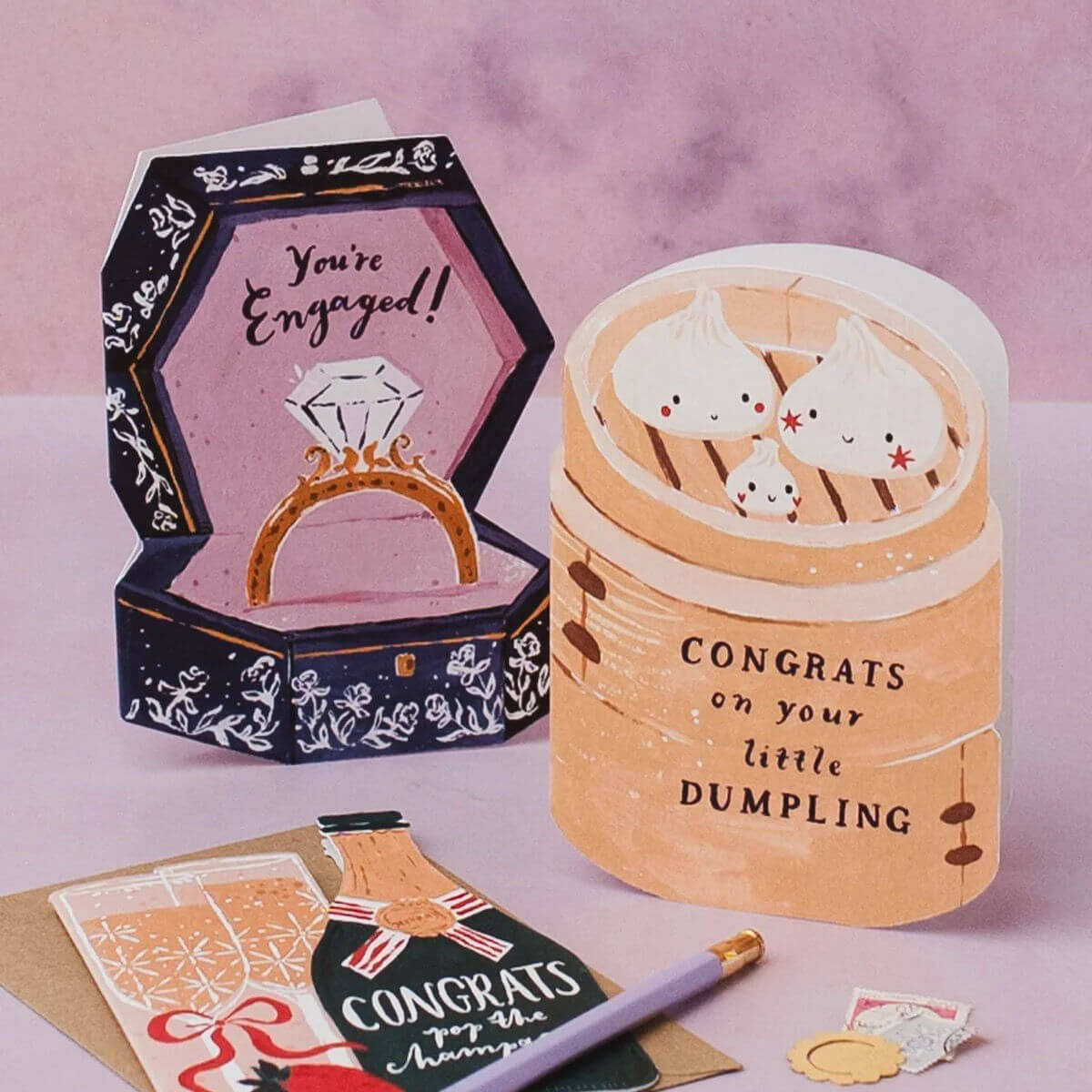 Dumpling New Baby card by Sister Paper Co. featuring three illustrated dumplings in a bamboo steamer