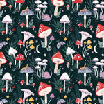 A repeating forest-themed pattern featuring red and white mushrooms, pale pink snails, lavender-purple mushrooms, green leaves, small yellow stars, and cream moons on a very dark teal background gift wrapping illustrated by sister paper co