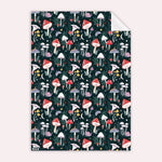 Patterned gift wrapping paper with colourful mushrooms on a dark background illustrated by sister paper co