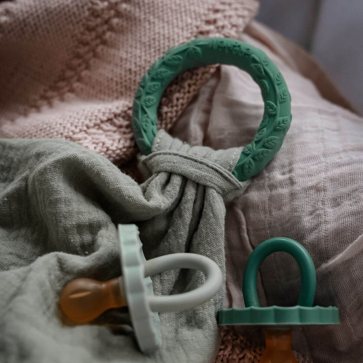 natruba organic comforter with natural rubber teething ring in green