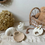 Eco-friendly shell-shaped baby toys displayed in a Montessori nursery – made from safe, plastic-free natural rubber