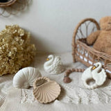 Eco-friendly shell-shaped baby toys displayed in a Montessori nursery – made from safe, plastic-free natural rubber