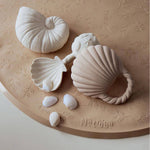 Close-up of Natruba Ocean Shell bath toy set on bath mat – non-toxic baby toys for teething and bathtime play