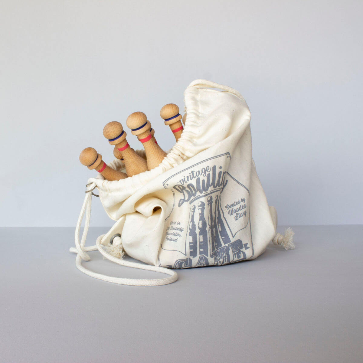 vintage wooden bowling set toy in blue by wooden story