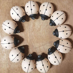 othat wooden push along toy ladybird in natural