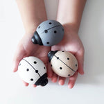 othat wooden push along toy ladybird in grey