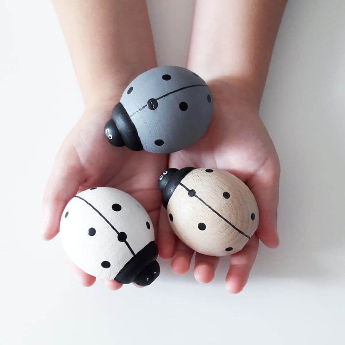 othat wooden push along toy ladybird in grey