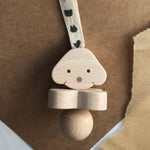 wooden rattle in dog design by KMR childwood