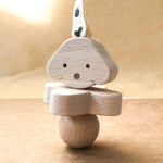 wooden rattle in dog design by KMR childwood