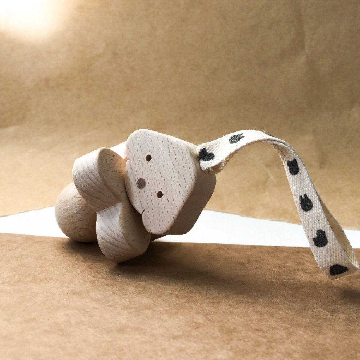 wooden rattle in dog design by KMR childwood