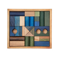 wooden building blocks in tray in cool colours by wooden story
